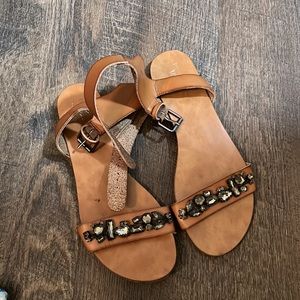 Size 8 brown leather sandal with gem detail.